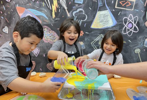 children playing an interactive game at a scşebce center