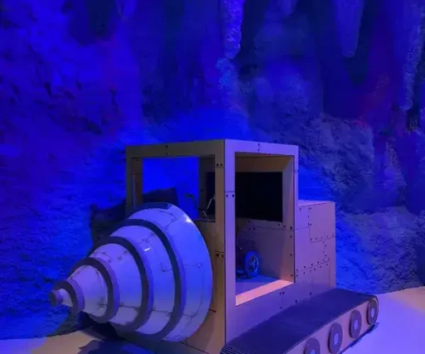 The Drill interactive exhibit — a large pedal-powered cave drill at Nickelodeon Play Istanbul