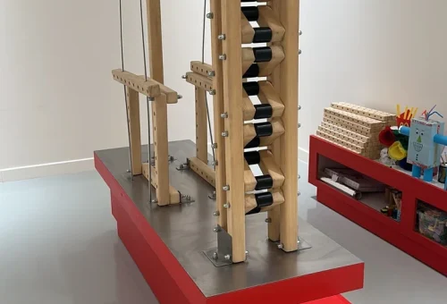 A tower built from the multi-hole wooden blocks of the Skyline Construction kit