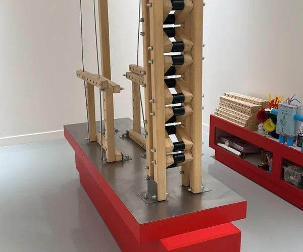 A tower built from the multi-hole wooden blocks of the Skyline Construction kit